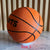 A teenager adult number 3/5/7 rotating basketball - brown high quality rubber material, very elastic - with sports logo and badg